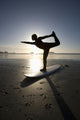 Silhouette Of Female Surfer Doing Bow Pulling Yoga Pose Wall Mural