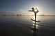 Silhouette Of Female Surfer Doing Bow Pulling Yoga Pose Wall Mural