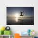 Silhouette Of Female Surfer Jumping For Joy Wall Mural