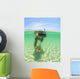 A Young Man Snorkels Holding A Starfish Underwater Wall Mural