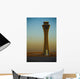 An Airplane Flies Past The Air Traffic Control Tower Wall Mural