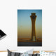 An Airplane Flies Past The Air Traffic Control Tower Wall Mural