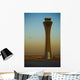 An Airplane Flies Past The Air Traffic Control Tower Wall Mural