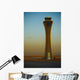 An Airplane Flies Past The Air Traffic Control Tower Wall Mural