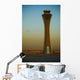 An Airplane Flies Past The Air Traffic Control Tower Wall Mural