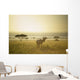 An Antelope Walks In The Grassland At Sunset Wall Mural