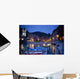 Boats Moored By Buildings Along The Waterfront At Night Wall Mural