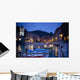 Boats Moored By Buildings Along The Waterfront At Night Wall Mural