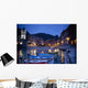 Boats Moored By Buildings Along The Waterfront At Night Wall Mural