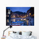 Boats Moored By Buildings Along The Waterfront At Night Wall Mural