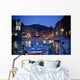 Boats Moored By Buildings Along The Waterfront At Night Wall Mural