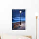 A Bench And Light Post Along The Railing On The Coast Wall Mural