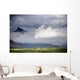 The Peak Of A Mountain Seen Through Low Lying Clouds Wall Mural