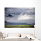 The Peak Of A Mountain Seen Through Low Lying Clouds Wall Mural