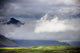 The Peak Of A Mountain Seen Through Low Lying Clouds Wall Mural