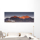 A Building On A Rock Ledge With Alpenglow Over The Mountains Wall Mural