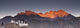 A Building On A Rock Ledge With Alpenglow Over The Mountains Wall Mural