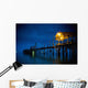 Lights On A Wooden Pier Leading Out In The Water At Night Wall Mural