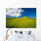 Wooden Fence Posts Running Through A Grassy Field Wall Mural