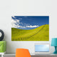 Wooden Fence Posts Running Through A Grassy Field Wall Mural