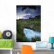 A Waterfall Surrounded By A Forested Area Wall Mural