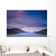 Mountains Along The Coastline Under A Cloudy Sky Wall Mural