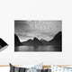 A Boat In The Water Along The Coast Surrounded By Mountains Wall Mural