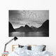 A Boat In The Water Along The Coast Surrounded By Mountains Wall Mural