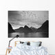 A Boat In The Water Along The Coast Surrounded By Mountains Wall Mural