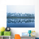 Trees Along The Shoreline Reflected In The Tranquil Water Wall Mural