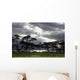 Sunlight Shining Through The Dark Clouds With Trees On The Shoreline Wall Mural