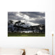 Sunlight Shining Through The Dark Clouds With Trees On The Shoreline Wall Mural