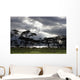 Sunlight Shining Through The Dark Clouds With Trees On The Shoreline Wall Mural