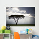 Sunlight Shining Through The Dark Clouds And A Lone Tree In A Field Wall Mural