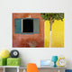 A Tree Outside A Colorful Building And A Window With Blue Shutters Wall Mural