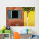 A Tree Outside A Colorful Building And A Window With Blue Shutters Wall Mural