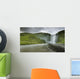 A Waterfall Over A Grassy Cliff Wall Mural