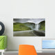 A Waterfall Over A Grassy Cliff Wall Mural