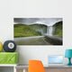 A Waterfall Over A Grassy Cliff Wall Mural