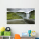 A Waterfall Over A Grassy Cliff Wall Mural