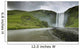 A Waterfall Over A Grassy Cliff Wall Mural