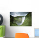 A Waterfall Over A Grassy Cliff Wall Mural
