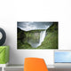 A Waterfall Over A Grassy Cliff Wall Mural