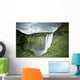 A Waterfall Over A Grassy Cliff Wall Mural
