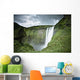 A Waterfall Over A Grassy Cliff Wall Mural