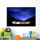 Tents Illuminated In A Valley At Night Wall Mural