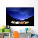Tents Illuminated In A Valley At Night Wall Mural