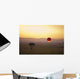 A Red Hot Air Balloon Takes Flight Against The Glowing Sky At Sunset Wall Mural