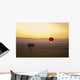 A Red Hot Air Balloon Takes Flight Against The Glowing Sky At Sunset Wall Mural