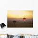 A Red Hot Air Balloon Takes Flight Against The Glowing Sky At Sunset Wall Mural
